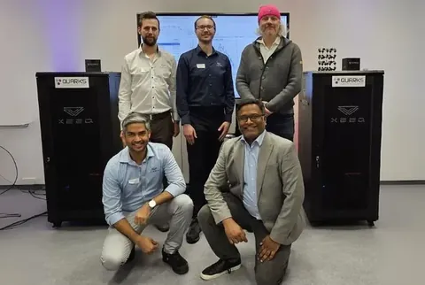 Five QUARKS project participants with two XeedQ quantum systems